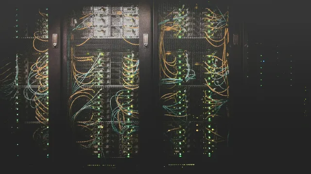 Server racks in a data centre, representing AWS load balancer infrastructure