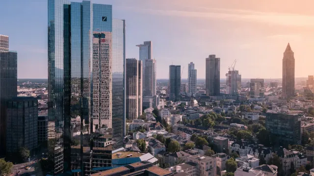 European city financial district skyline, representing EU entities in scope for the NIS2 directive