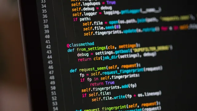 Lines of source code on a dark computer screen, representing penetration testing of internet-facing systems