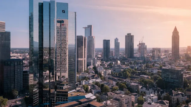 European city financial district skyline, representing EU entities in scope for the NIS2 directive