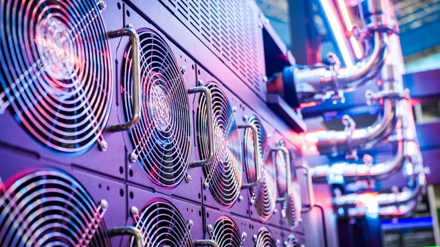 Close-up of server cooling fans inside a data center, representing critical system infrastructure
